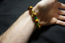 Load image into Gallery viewer, Golden, Green Glass Bead Bracelet - Caliculturesmokeshop.com
