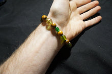 Load image into Gallery viewer, Golden, Green Glass Bead Bracelet - Caliculturesmokeshop.com
